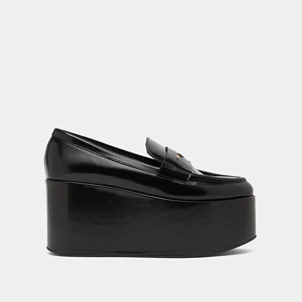 Platform loafers in black glazed leather